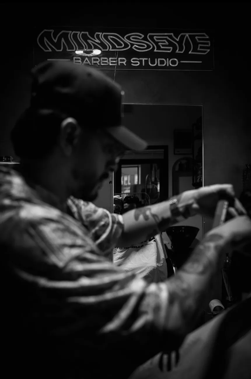 Brian at work at Minds Eye Barber Studio